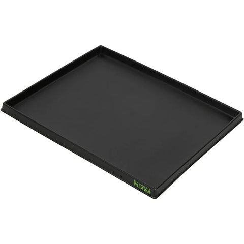 Black rectangular plastic tray with raised sides for an indoor dog grass potty pad.