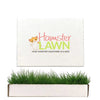 HamsterLawn Petite real grass pad with branded packaging and fresh green grass growing from the tray.
